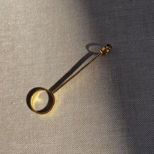 Gold plated with pink stones cigarette holder/joint holder ring.